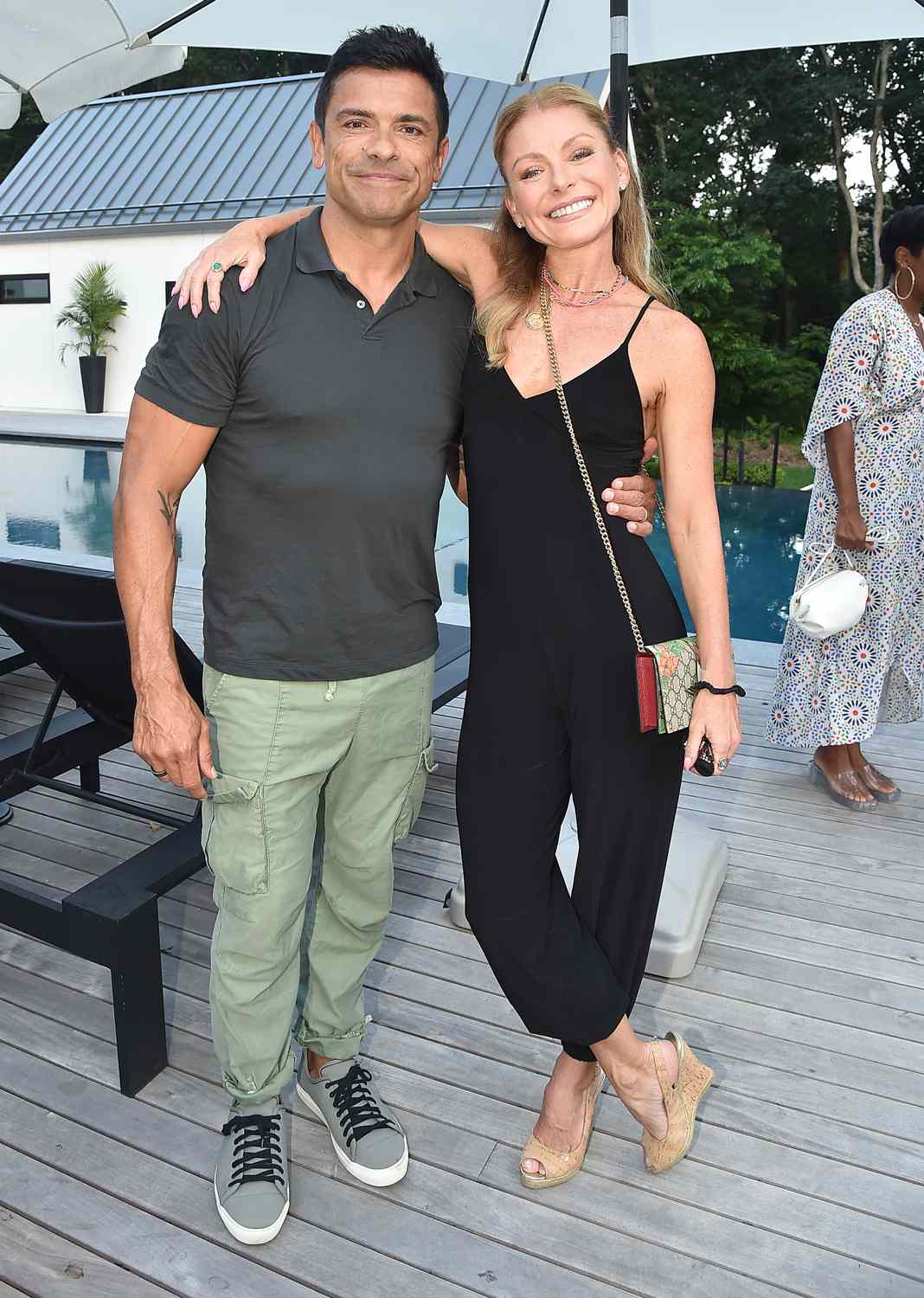 Mark Consuelos and Kelly Ripa attend Michael Gelman & Ali Wentworth Celebrate The Launch Of Yoga Pant Nation By Laurie Gelman at Private Residence on July 16, 2021 in Water Mill, NY.