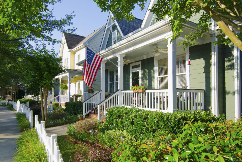 The American Dream of a house in a nice neighborhood with a white picket fence.