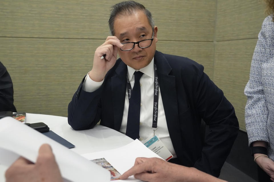 Eric Choy, executive director at U.S. Customs and Border Protection's office of trade, speaks during an interview at the North American Seafood Expo, Monday, March 11, 2024, in Boston. Choy says the CBP does investigate allegations of abuse. “You’d hope that there was a magic button that you can push and then everything created by forced labor is prohibited from entering, but it’s a much harder task. ... It does require us to follow the trail.” (AP Photo/Steven Senne)