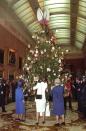 <p>Queen Elizabeth and the Queen Mother admire the Queen's Christmas Tree in the Picture Gallery. Artists presented the royal family with 500 crafted ornaments, which were auctioned off for charity.</p>