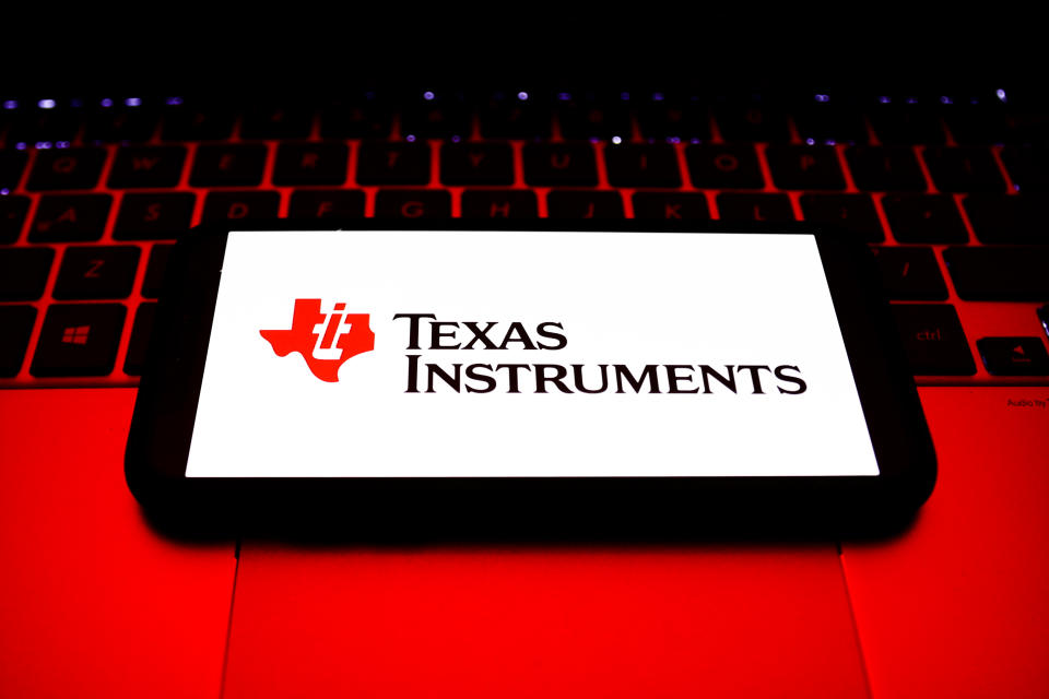 Texas Instruments logo displayed on a phone screen and a laptop keyboard are seen in this illustration photo taken in Krakow, Poland on October 30, 2021. (Photo by Jakub Porzycki/NurPhoto via Getty Images)
