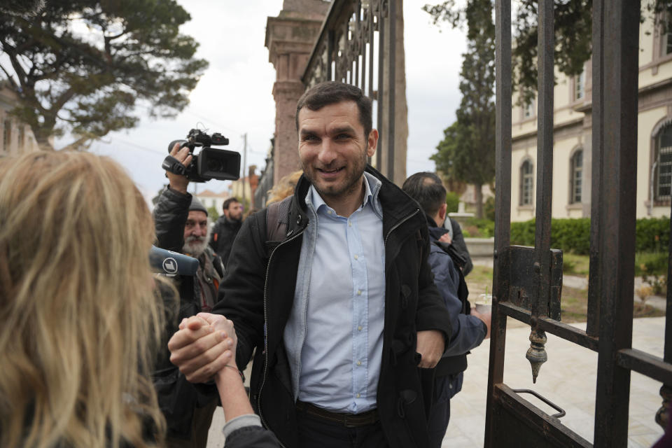 Nasos Karakitsos, one of 24 aid workers and volunteers accused of participating in migrant rescue operations, arrives at the court in Mytilene, on the northeastern Aegean island of Lesbos, Greece, Tuesday, Jan. 10, 2023. A Greek court was set to hear a smuggling-related criminal case Tuesday against a group of 24 aid workers and volunteers. The defendants deny all charges and say all they did was help rescue endangered people. International human rights groups have widely criticized the prosecution. (AP Photo/Panagiotis Balaskas)