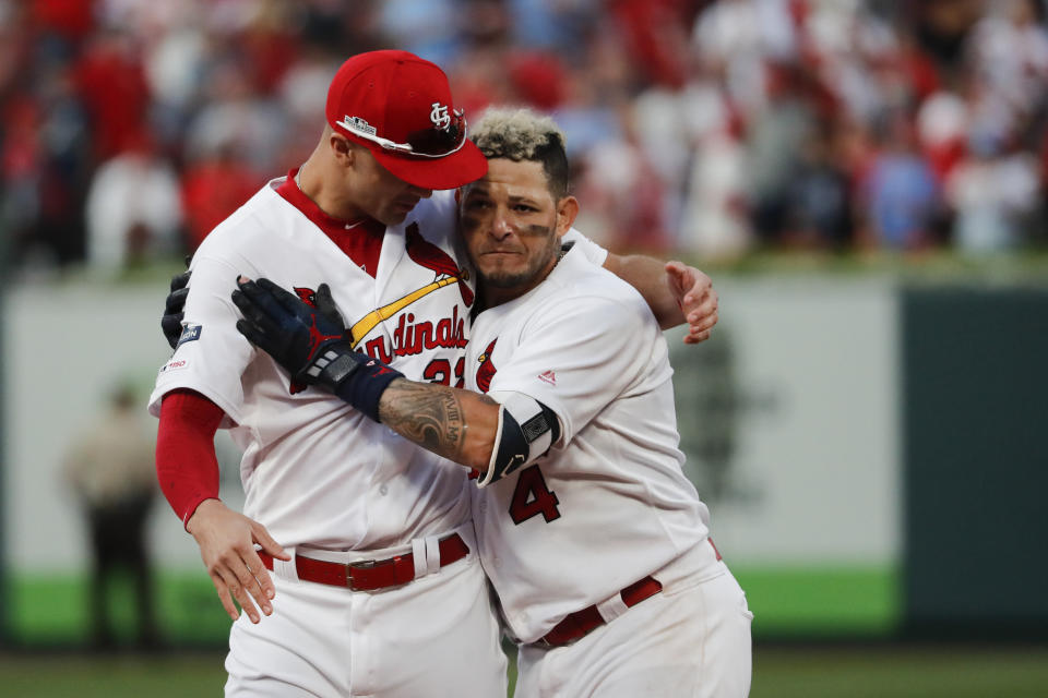St. Louis Cardinals' Yadier Molina, right, celebrates with Jack Flaherty after hitting a sacrifice fly to score Kolten Wong and defeat the Atlanta Braves in Game 4 of a baseball National League Division Series, Monday, Oct. 7, 2019, in St. Louis. (AP Photo/Jeff Roberson)