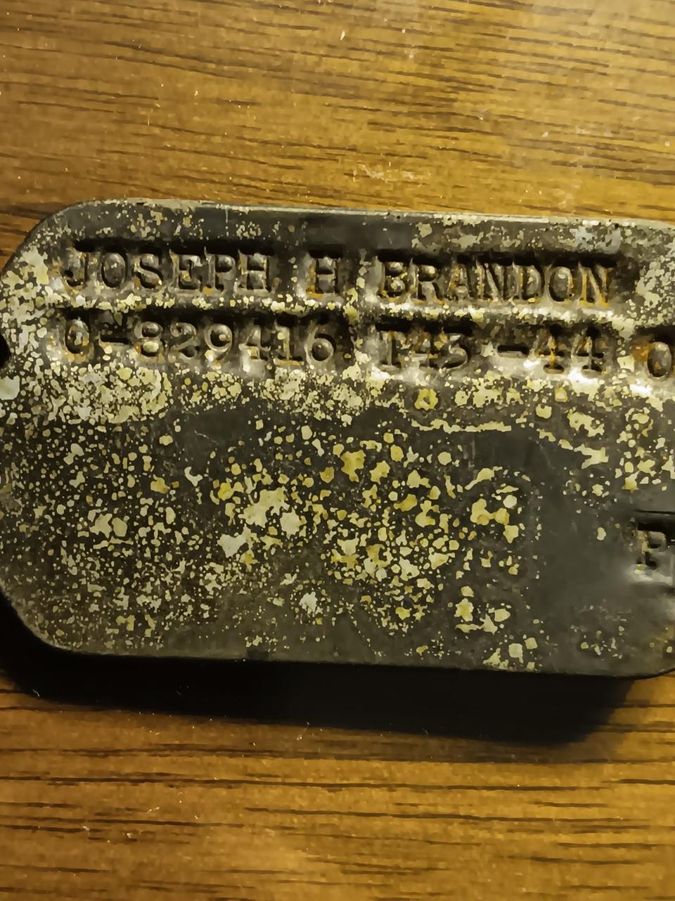 The dog tag of Joseph Brandon, who was killed in an airplane crash in Cervinara, Italy in 1945. The dog tag was recovered by Raimondo Brevetti, who was 19 years old at the time.