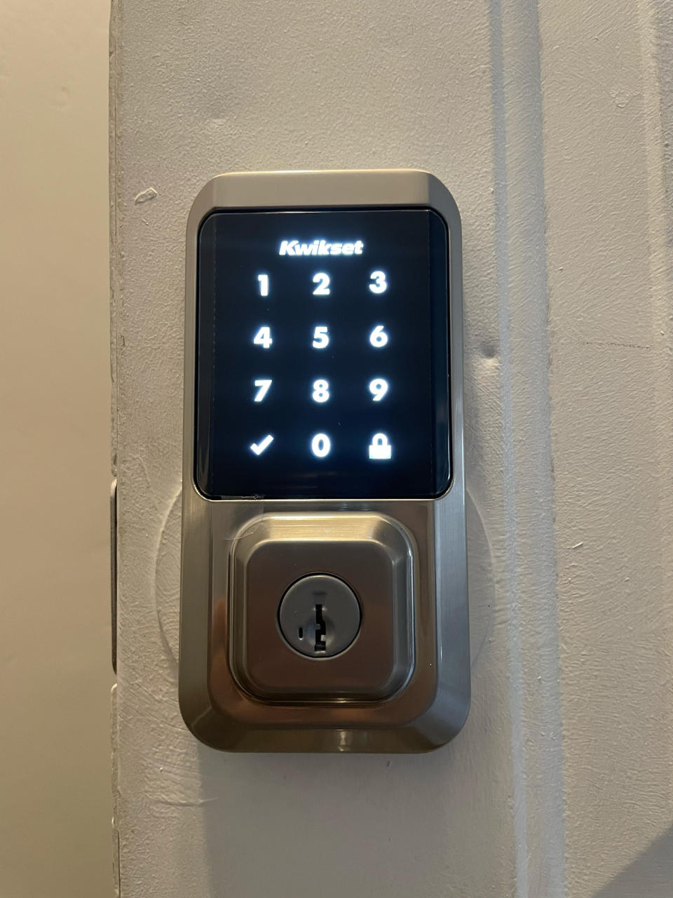 Kwikset smart lock installed on door, smart locks