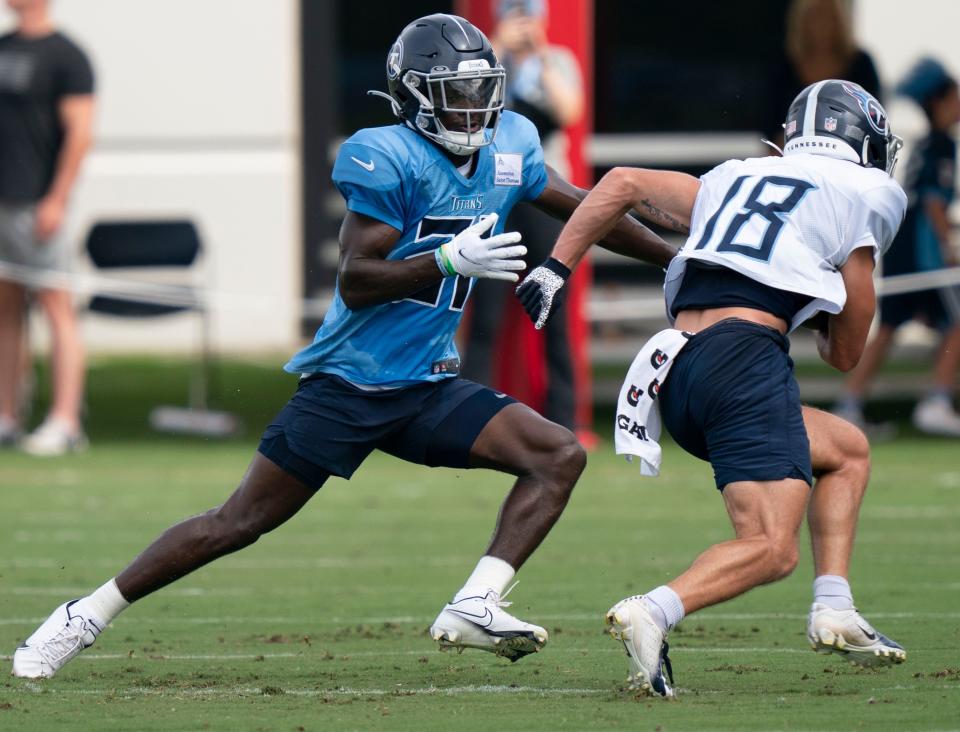 Tennessee Titans cornerback Roger McCreary (21) tries to stop wide receiver Kyle Phillips (18) during a training camp practice at Ascension Saint Thomas Sports Park Thursday, Aug. 4, 2022, in Nashville, Tenn. 