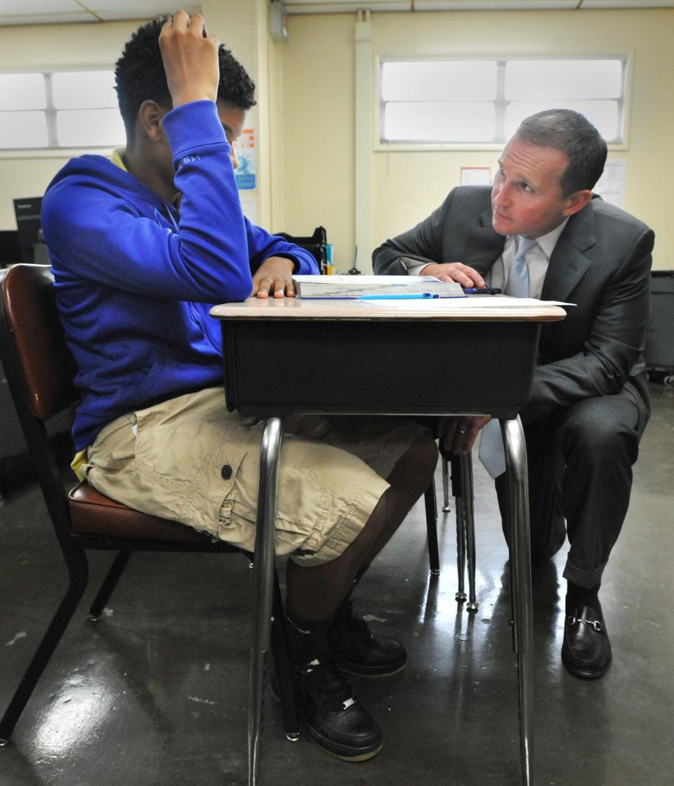 Mayor Lenny Curry talks with a student in the Alternative To Out of School Suspension (ATOSS) Center at Southside Middle School Monday, Nov. 9, 2015 in Jacksonville, Fla. Truancy officer Deborah Westberry is on the right. (The Florida Times-Union, Will Dickey)