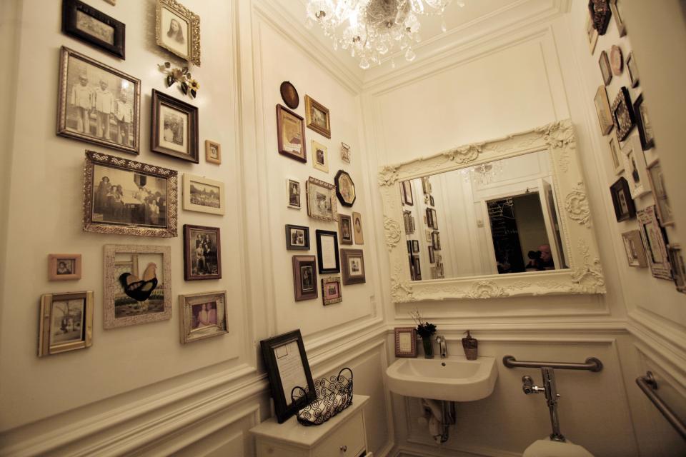 Chef Marcus Samuelsson, owner of the Red Rooster in New York, has decorated the bathrooms of his restaurant with vintage photos, Tuesday, Feb. 7, 2012. (AP Photo/Richard Drew)