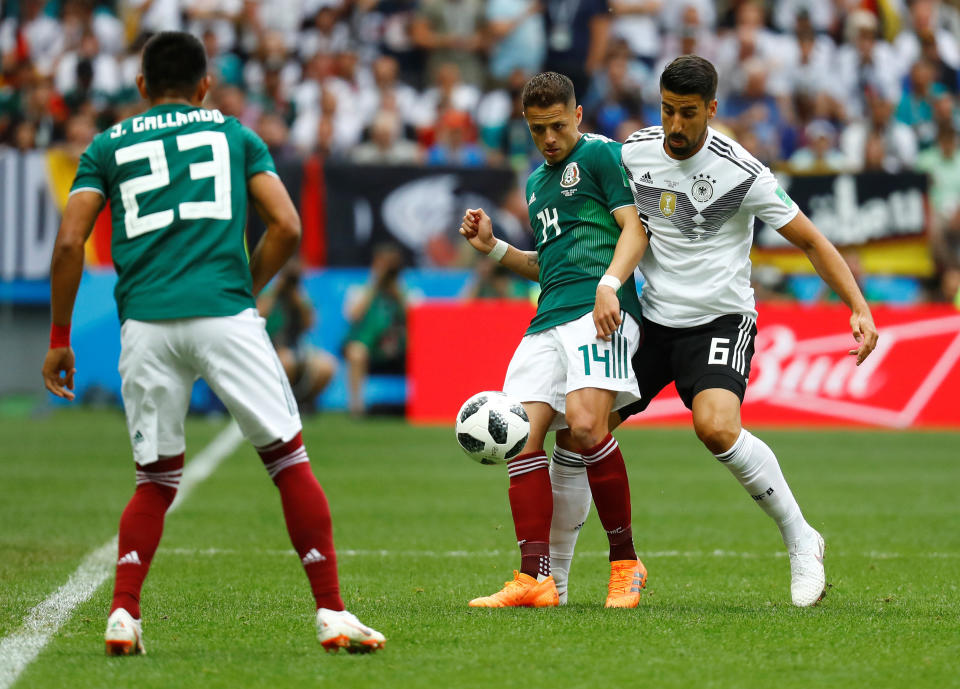 Mexico's Javier Hernandez in action with Germany's Sami Khedira.