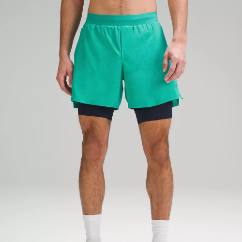 man wearing sea foam green lululemon tennis shorts