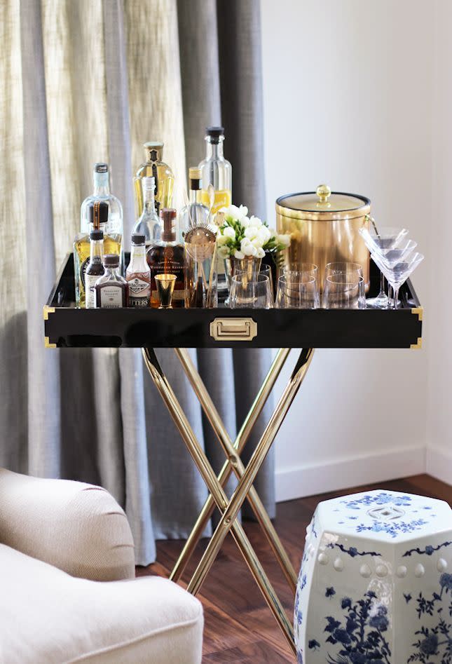 The Tray Stand Bar If space is limited, this is the bar for you. Perfect for positioning beside the sofa or in the corner of the kitchen when friends are over for dinner, it’s beautifully styled and gender neutral to boot.