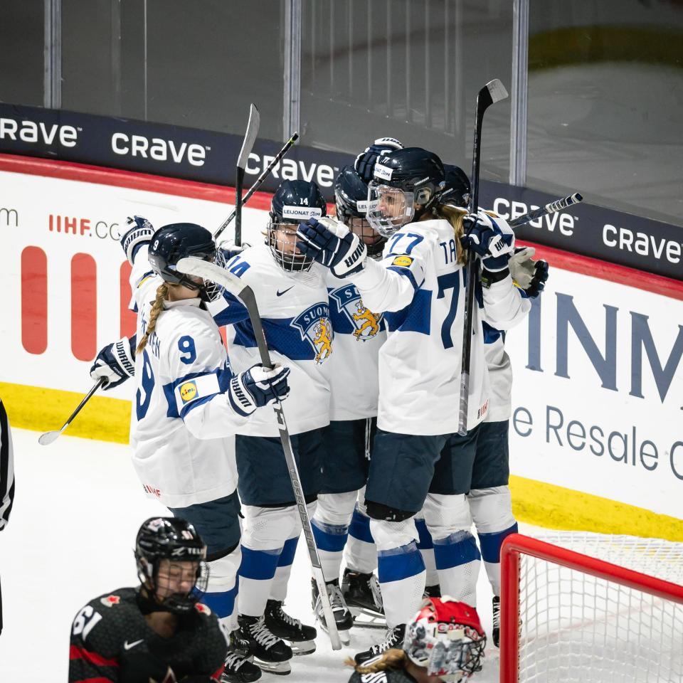Finland's Petra Nieminen (16) celebrates with teammates after scoring a goal against Canada April 4 at the Adirondack Bank Center in Utica, Team Finland was celebrating again Thursday after beating Switzerland 3-1 in the quarterfinals of the Women's World Championship.