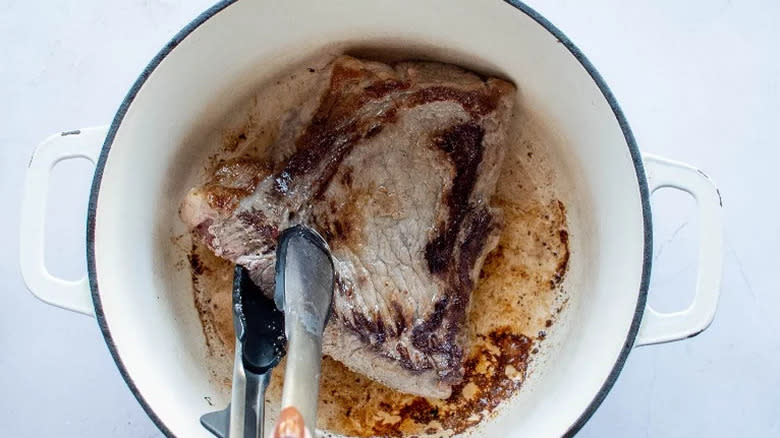 Rump steak searing in a Dutch oven 