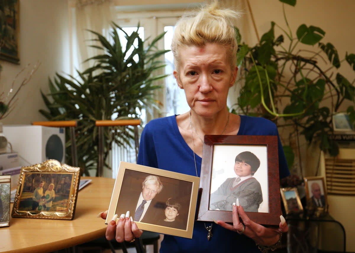 Jasna Badzak holding photographs of her son Sven (PA Archive)