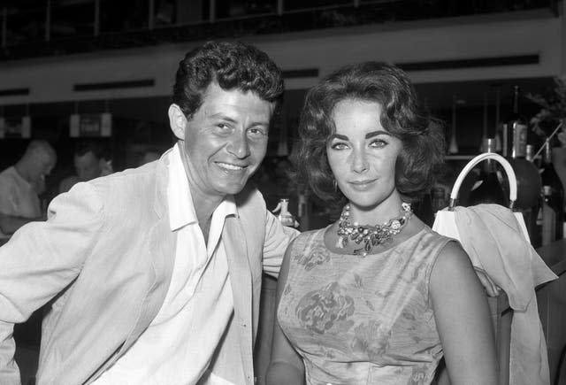 Singer Eddie Fisher with actress Elizabeth Taylor at London Airport 