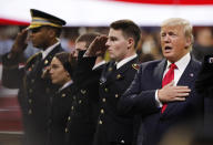 <p>President Donald Trump sings the national anthem before the NCAA college football playoff championship game between Georgia and the AlabamaMonday, Jan. 8, 2018, in Atlanta. (AP Photo/David Goldman) </p>