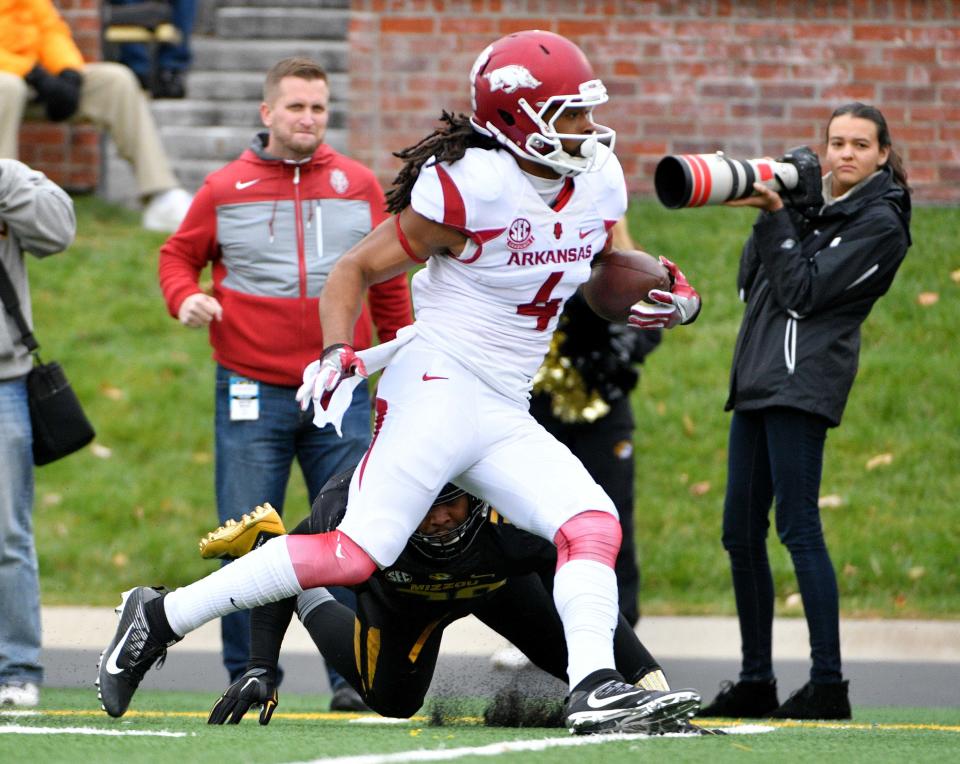 Nov 25, 2016; Columbia, MO, USA; Arkansas Razorbacks wide receiver Keon Hatcher (4) runs the ball as Missouri Tigers linebacker Eric Beisel (38) attempts the tackle during the first half at Faurot Field. Missouri won 28-24. Mandatory Credit: Denny Medley-USA TODAY Sports