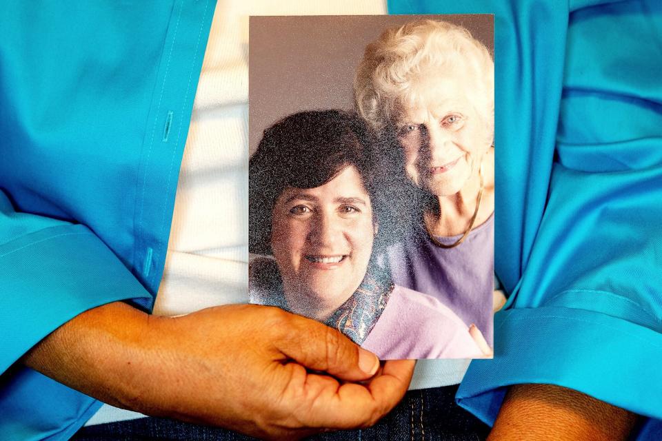 Dorene Giacopini holds a photo of her with her mother, Primetta Giacopini, from her home in Richmond, Calif. on . Primetta Giacopini's life ended the way it began - in a pandemic. She was two years old when she lost her mother to the Spanish flu in Connecticut in 1918. Giacopini contracted COVID-19 earlier this month. The 105-year-old struggled with the disease for a week before she died Sept. 16 Virus Outbreak Double Pandemic, Richmond, United States - 27 Sep 2021