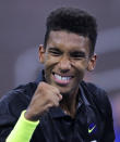 FILE - In this Aug. 27, 2019, file photo, Felix Auger-Aliassime, of Canada, pumps his fist after winning a point against Denis Shapovalov, of Canada, during the first round of the U.S. Open tennis tournament in New York. Of particular interest is when a new face will emerge from the crop of 20-somethings who have been rising in the rankings. (AP Photo/Charles Krupa, File)