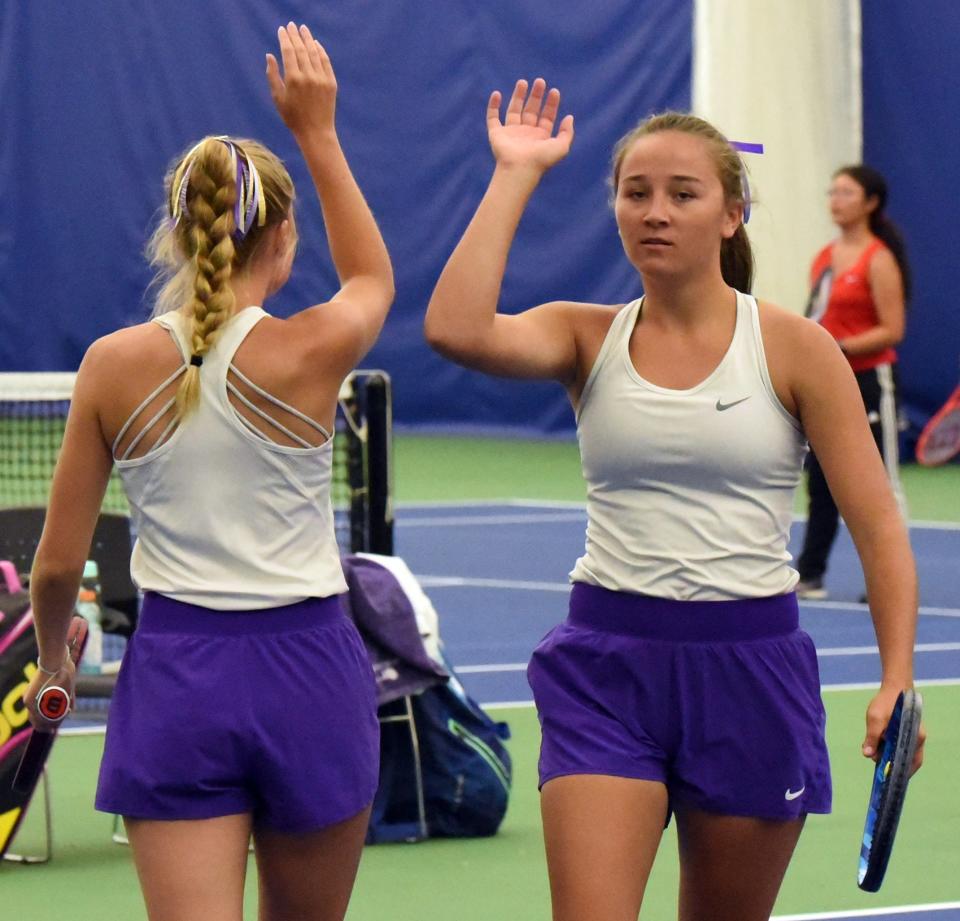 Watertown's Leyla Meester, right, and Ellie Zink give each other a high-five after winning a point during the flight one doubles fifth place match at the South Dakota state Class AA Girls Tennis Tournament on Friday, Oct. 6, 2023 in Sioux Falls.