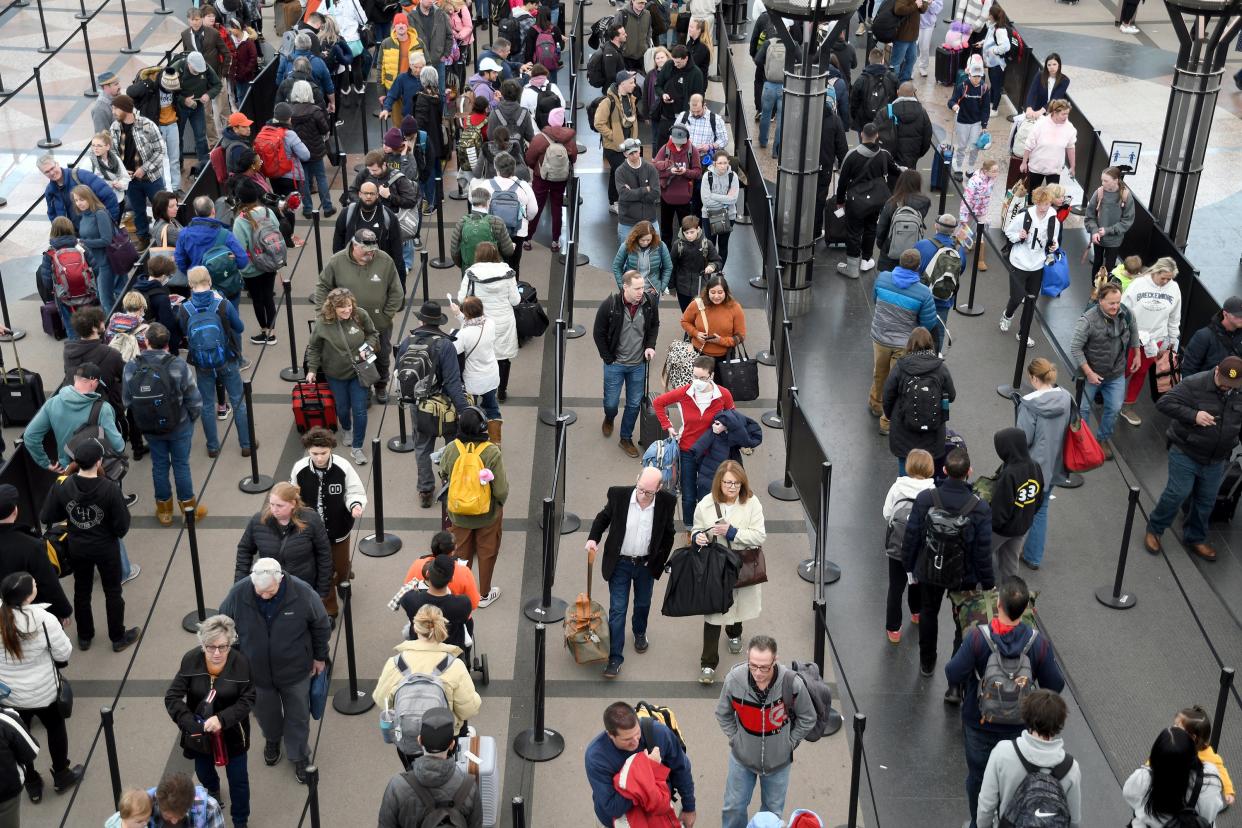 Passengers wait in a security line at Denver International Airport on Wednesday. Winter storm Olive has prompted hundreds of flight cancellations (AP Photo/Thomas Peipert) (Copyright 2023 The Associated Press. All rights reserved.)