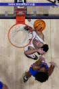 Alabama guard Mark Sears (1) and Florida guard Zyon Pullin (0) jockey position under the basket during the first half of an NCAA college basketball game at the Southeastern Conference tournament Friday, March 15, 2024, in Nashville, Tenn. (AP Photo/John Bazemore)