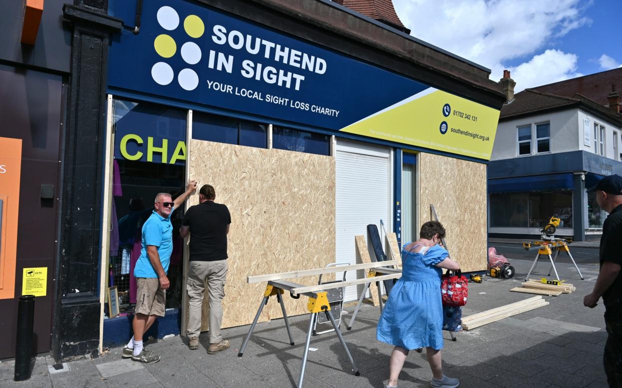 A charity shop is boarded up in Westcliff a suburb of Southend