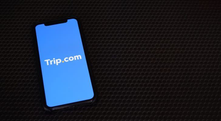 a smartphone displays the Trip.com app