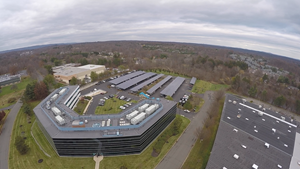 Konica Minolta’s corporate headquarters based in Ramsey, NJ runs on 100 percent green energy sourced from a combination of wind, hydro and solar energy. The solar energy system consists of carport canopies supporting solar panels that produce about 10 – 15 percent of the campus’ energy needs.