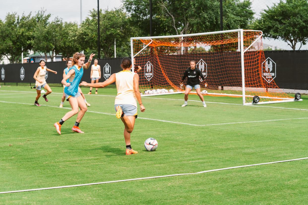 Erin McKinney gets set to make a save while working out with her newest professional soccer team, the Houston Dash of the NWSL in Houston, Texas.