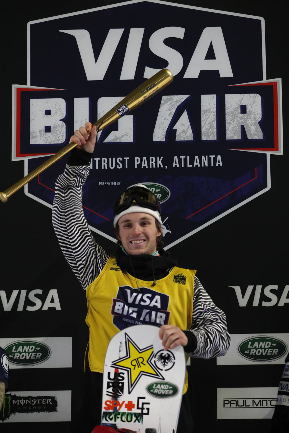 Chris Corning stands on the podium after winning the Big Atlanta snowboard event Friday, Dec. 20, 2019, in Atlanta. (AP Photo/John Bazemore)