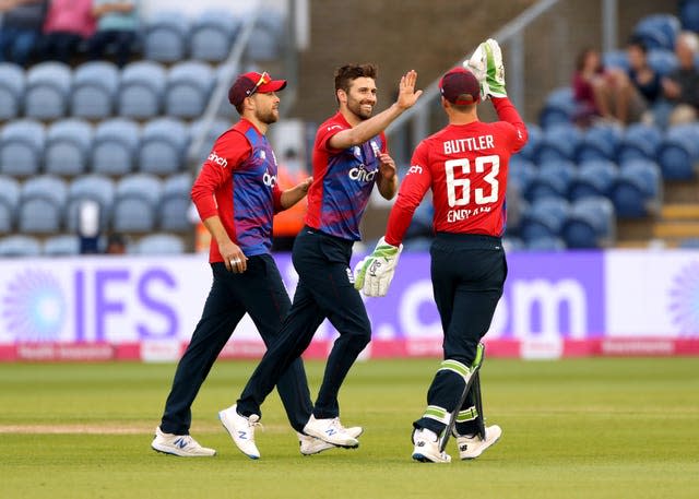 Mark Wood, centre, took eye-catching figures of four for 23 against the Black Caps (David Davies/PA)