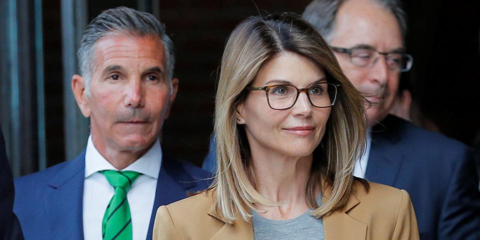 Actor Lori Loughlin, and her husband, fashion designer Mossimo Giannulli, leave the federal courthouse after facing charges in a nationwide college admissions cheating scheme, in Boston, Massachusetts,.JPG
