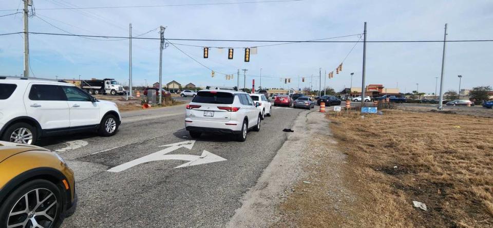 Traffic gathers along Legends Drive waiting to turn onto U.S. Highway 501 in Horry County on Jan. 11, 2023.