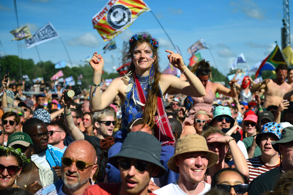 GLASTONBURY, ENGLAND - JUNE 26: Members of the audience watch Diana Ross during day five of Glastonbury Festival at Worthy Farm, Pilton on June 26, 2022 in Glastonbury, England. The 50th anniversary of Glastonbury’s inaugural event in 1970 was postponed twice after two cancelled events, in 2020 and 2021, due to the Covid pandemic. The festival, founded by farmer Michael Eavis, is the largest greenfield music and performing arts festival in the world. (Photo by Jim Dyson/Getty Images)