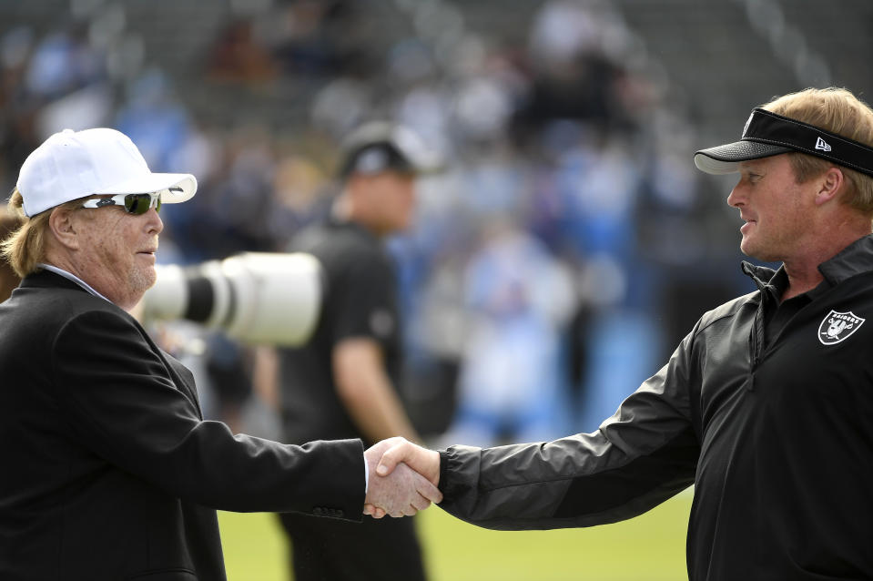 Might Raiders owner Mark Davis, left, or head coach Jon Gruden have anything to do with the team's recent rash of departures? (Photo by Kevork Djansezian/Getty Images)