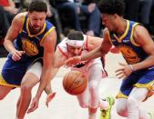 May 20, 2019; Portland, OR, USA; Golden State Warriors guard Klay Thompson (11) and Warriors' guard Quinn Cook (4) strip the ball from Portland Trail Blazers guard Seth Curry (31) in the first half of game four of the Western conference finals of the 2019 NBA Playoffs at Moda Center. Mandatory Credit: Jaime Valdez-USA TODAY Sports