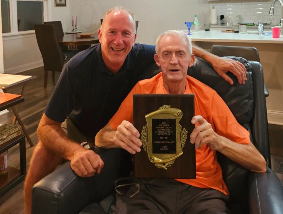 Federal League commissioner Terry Peterson (left) and former commissioner Joe Eaton are pictured last month at Eaton's home in North Carolina. Peterson surprised Eaton with the league establishing the Joe Eaton Federal League Courageous Student-Athlete of the Year.