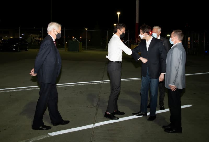 Michael Kovrig and Michael Spavor, accompanied by Canada's Ambassador to China, Domenic Barton, arrive in Calgary