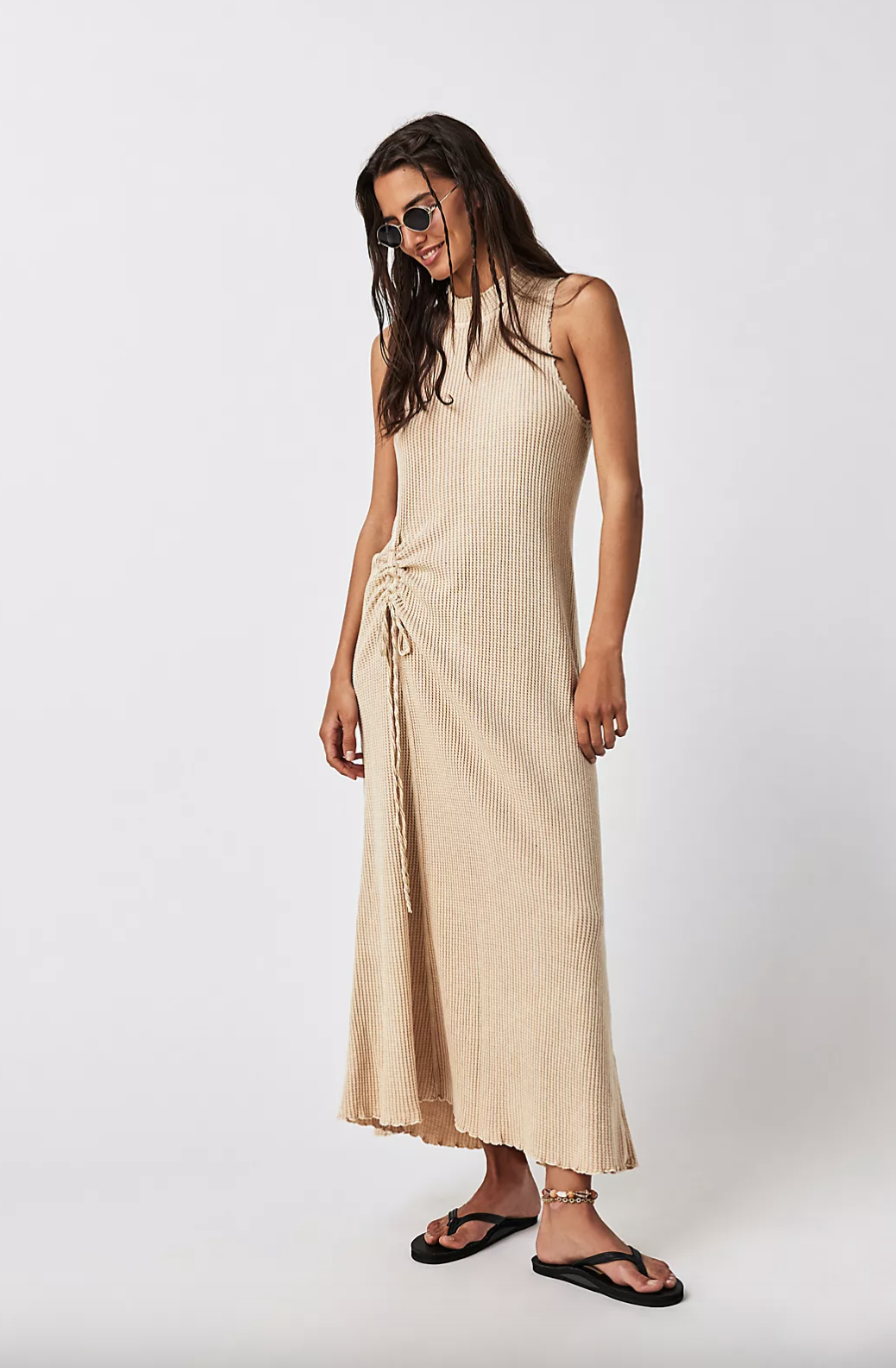 model wearing beige FP One Natasha Sleeveless Midi (photo via Free People)