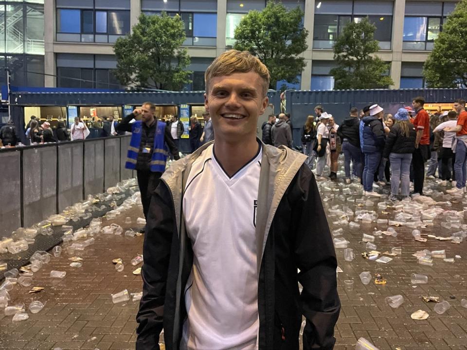 24-year-old Steven Currie tries to stay positive after a “gutting” loss to Spain. Hundreds of empty pint cups litter the floor around him (Tom Watling)