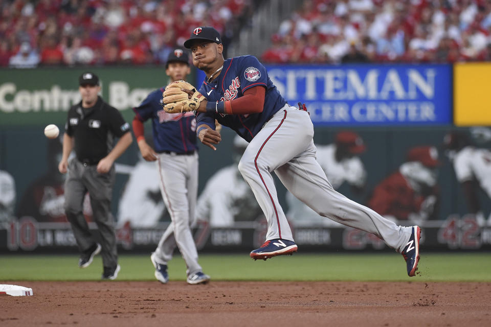 Minnesota Twins second baseman Jorge Polanco throws out St. Louis Cardinals' Harrison Bader at first during the second inning of a baseball game Friday, July 30, 2021, in St. Louis. (AP Photo/Joe Puetz)