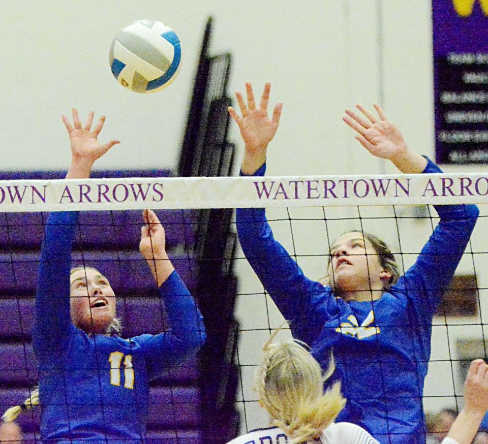 Aberdeen Central's Grace Kuch attempts to hit the ball back over the net as teammate Lauryn Burckhard looks on during an Eastern South Dakota Conference volleyball match against Watertown on Tuesday, Oct. 25, 2022 in the Watertown Civic Arena. Aberdeen Central won 3-1.