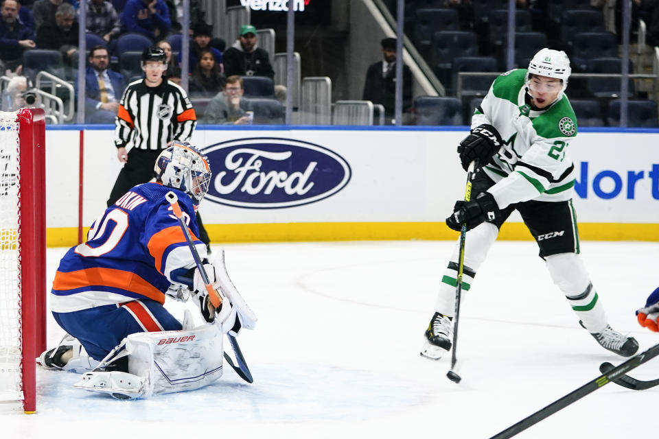 Dallas Stars' Jason Robertson (21) shoots the puck past New York Islanders goaltender Ilya Sorokin (30) for a goal during the first period of an NHL hockey game Tuesday, Jan. 10, 2023, in Elmont, N.Y. (AP Photo/Frank Franklin II)