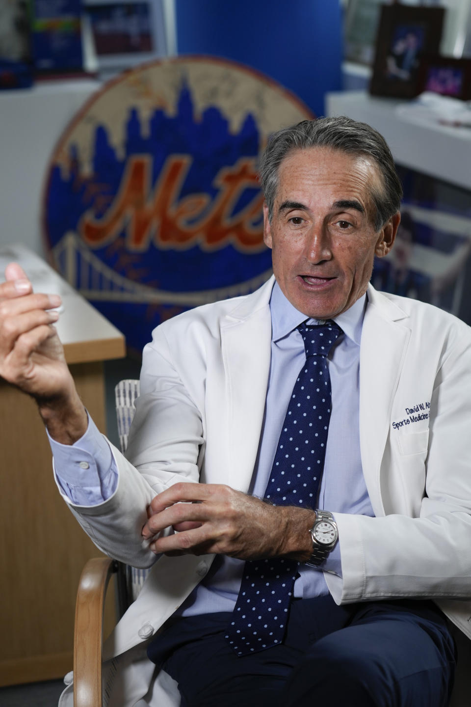 Dr. David Altchek talks about some aspects of Tommy John surgery in his office in New York, Thursday, Feb. 29, 2024. (AP Photo/Seth Wenig)