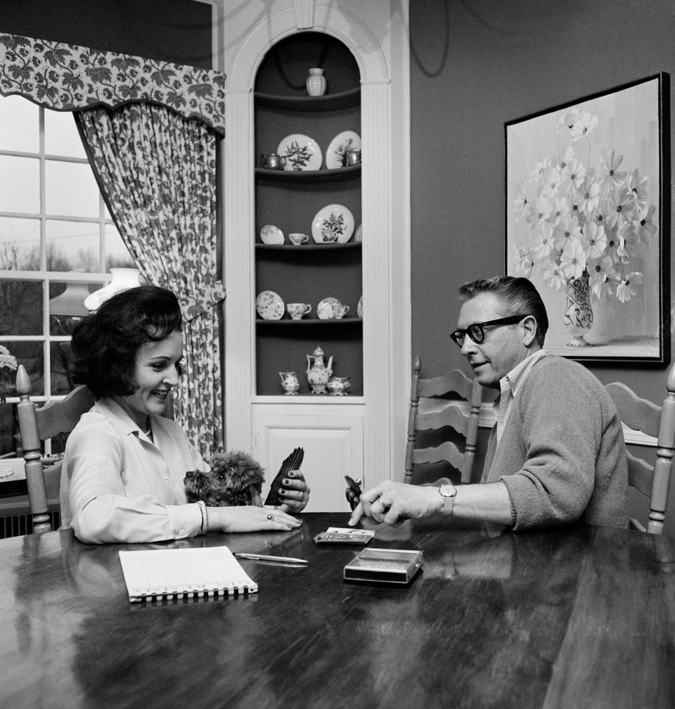 In this April 29, 1965 photo, Betty White and her husband, Allen Ludden, continue a two-year gin rummy battle in Westchester, N.Y. White and the "Password" game show host from Wisconsin were married in 1963. Ludden died in 1981 and is buried in his hometown of Mineral Point.