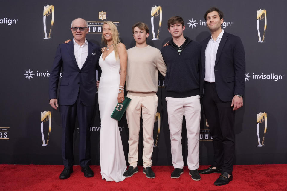 New York Jets owner Woody Johnson, left, poses with his family on the red carpet at the NFL Honors award show ahead of the Super Bowl 58 football game Thursday, Feb. 8, 2024, in Las Vegas. The San Francisco 49ers face the Kansas City Chiefs in Super Bowl 58 on Sunday. (AP Photo/Charlie Riedel)