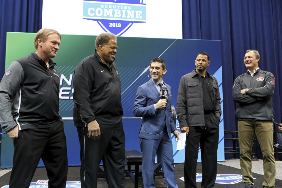 From left, Oakland Raiders head coach Jon Gruden, GM Reggie McKenzie, NFL Network host Andrew Siciliano, Hall of Famer Rod Woodson and San Francisco 49ers GM John Lynch ar seen at the official coin flip to determine the 9th and 10th picks for the 2018 NFL Draft on Friday. (AP)