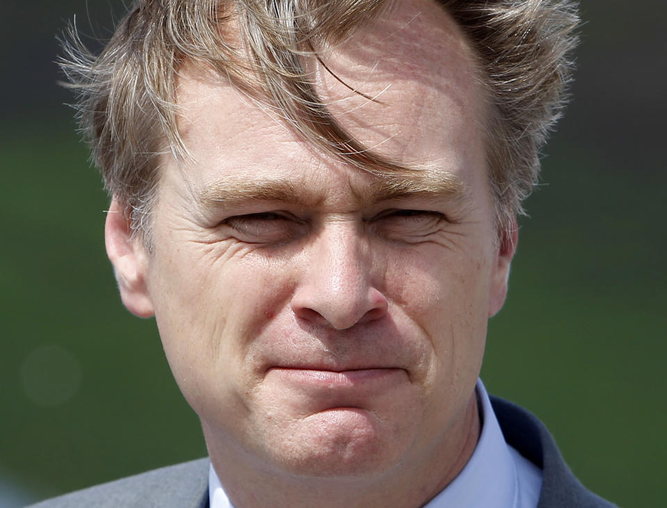 FILE - In this file photo dated Sunday, July 16, 2017, movie director Christopher Nolan poses at the premiere of the movie "Dunkirk," in Dunkirk, northern France. Nolan is among those being recognized in Britain’s royal New Year’s Honors List, according to the list of recipients released Friday Dec. 28, 2018. (AP Photo/Michel Spingler, FILE)