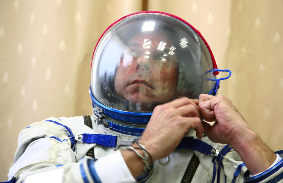Guy Laliberte prepares for exercises during a training session in the International Space Station (ISS) training module at the Star City space centre outside Moscow, August 25, 2009. The Canadian billionaire, also owner of Cirque du Soleil, is on the countdown to become the world&#39;s seventh, and Canada&#39;s first space tourist slated to travel on a Russian Soyuz space craft to the ISS in September.  REUTERS/Sergei Remezov  (RUSSIA SCI TECH TRANSPORT SOCIETY IMAGES OF THE DAY)